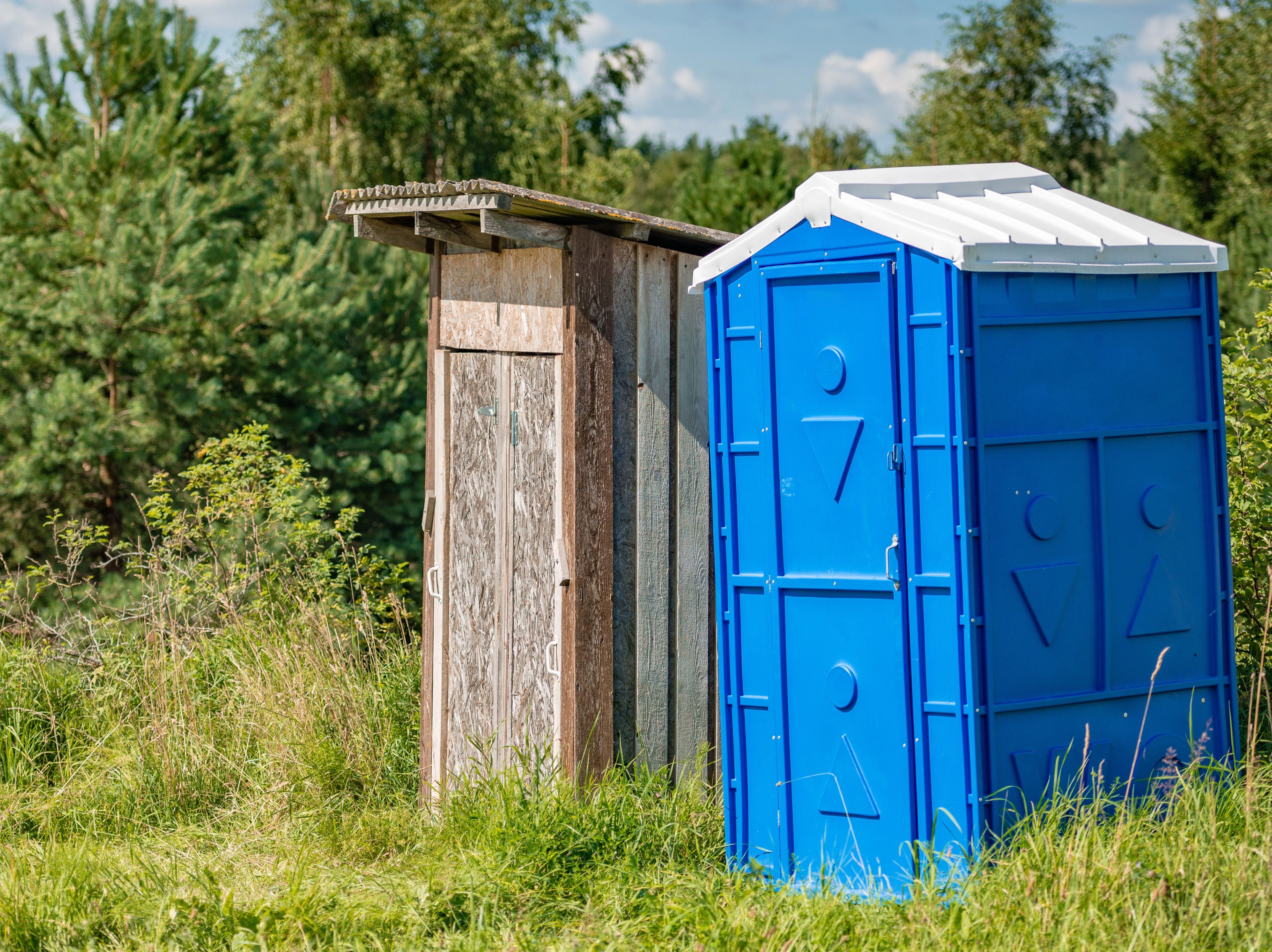 edge-of-the-forest-stands-an-old-wooden-toilet-and